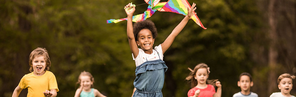 Group of children holding a banner with text